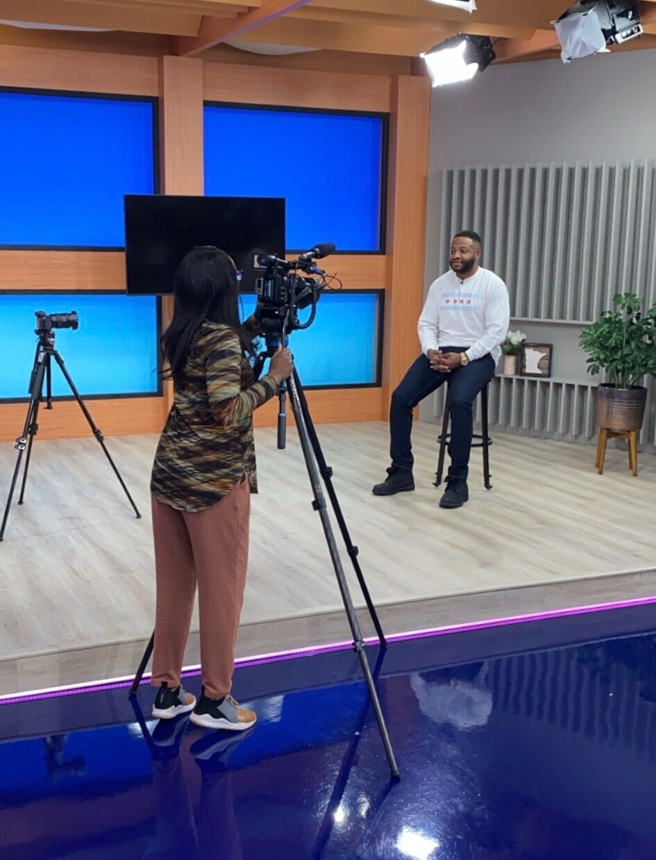 Robert Harper being interviewed in a television studio